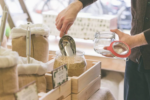 little plant pantry an organic, vegan and plastic-free shop in amsterdam showing someone buying in bulk